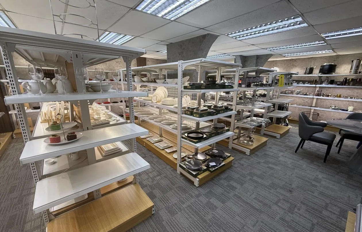 Tableware, cookware and chafing dishes on the display racks in the Pasay showroom